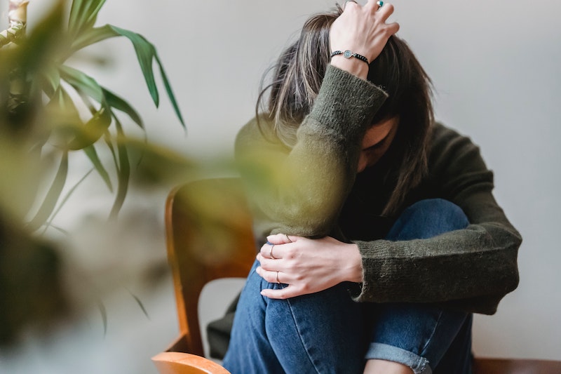 Person sitting near a bright window, representing anxiety support and mental health care.