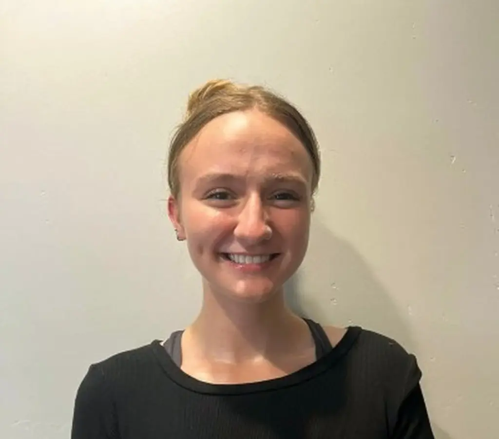 Hailey Armus portrait, Individual Counseling in Montbello - CO during a private therapy conversation in a calm office setting